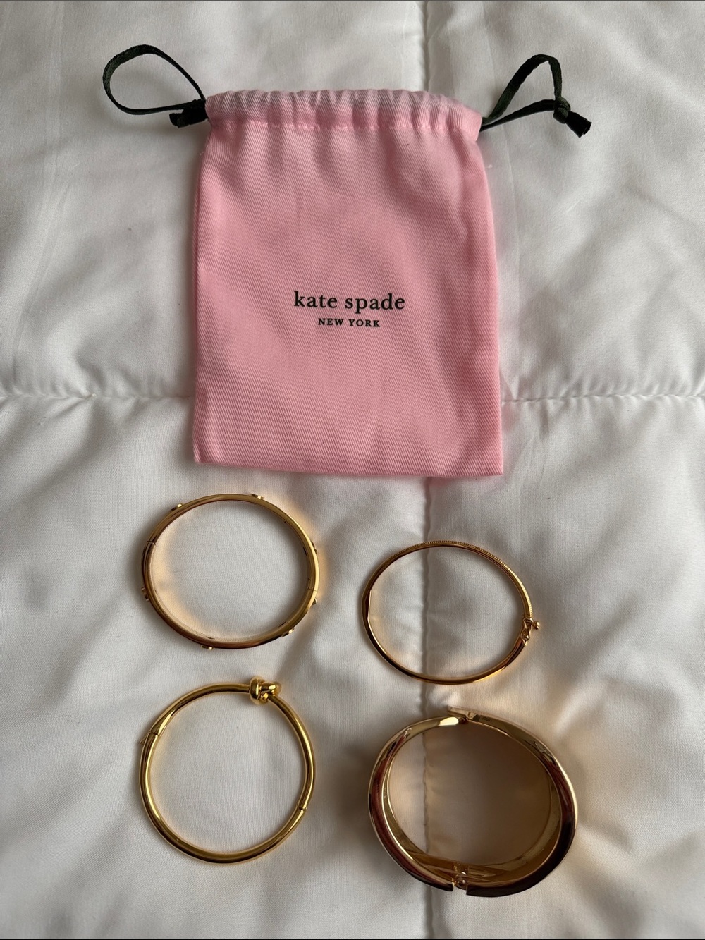 Two kate spade Gold-tone Bangle Bracelet Set with Pink Drawstring Pouch.